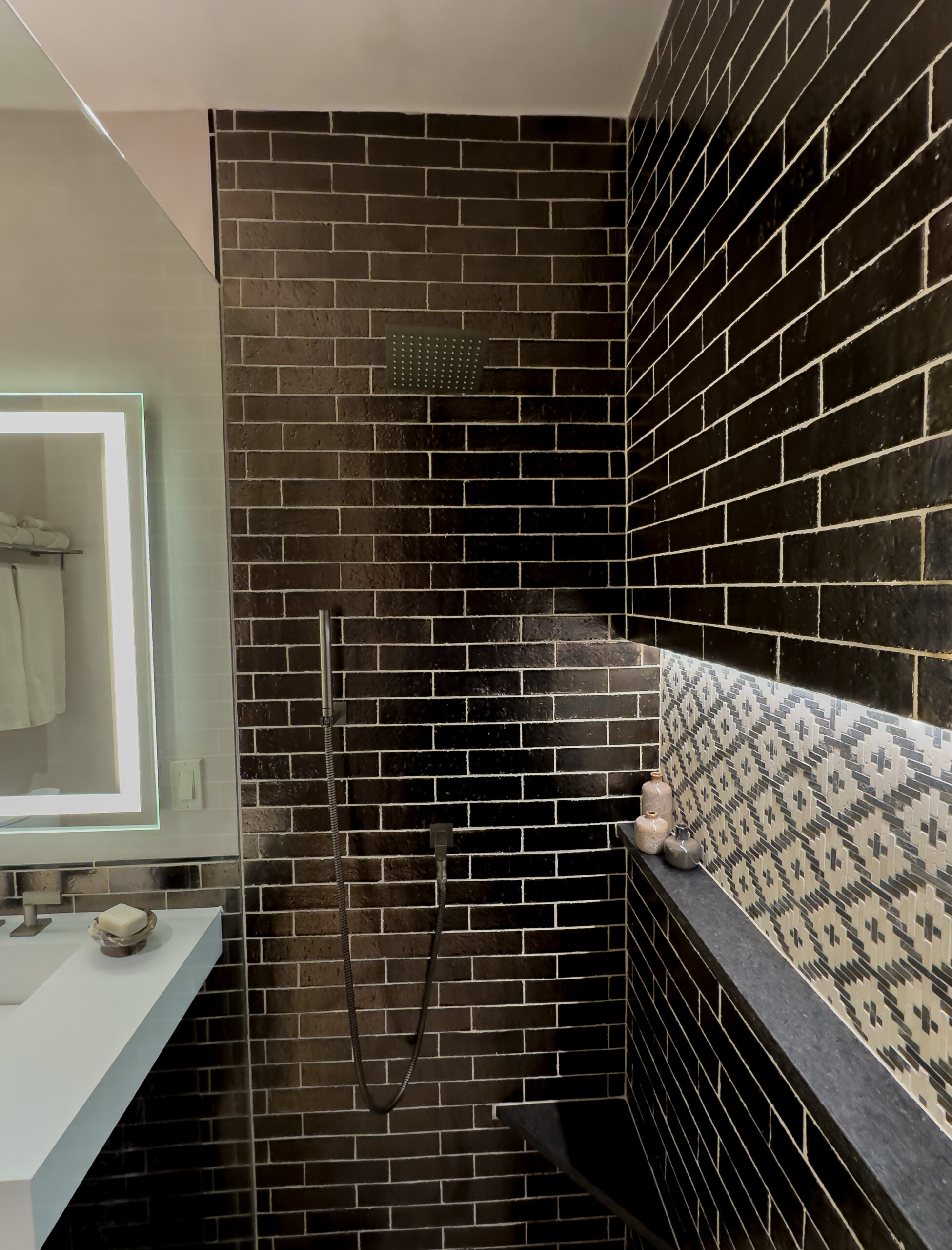 hirez©danielquatphoto-IMG_2054 detail of walk-in custom shower with black subway tile and patterned white tile accent in recess, custom luxury bathroom design by J Stoilis Design